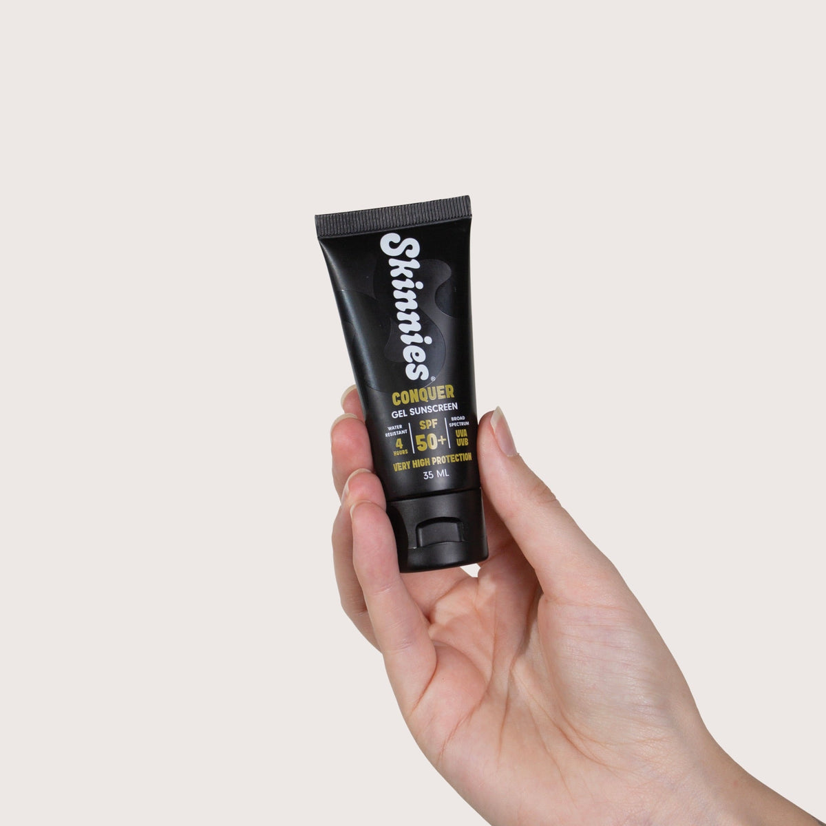 Skinnies CONQUER SPF50+ 35ml in hand
